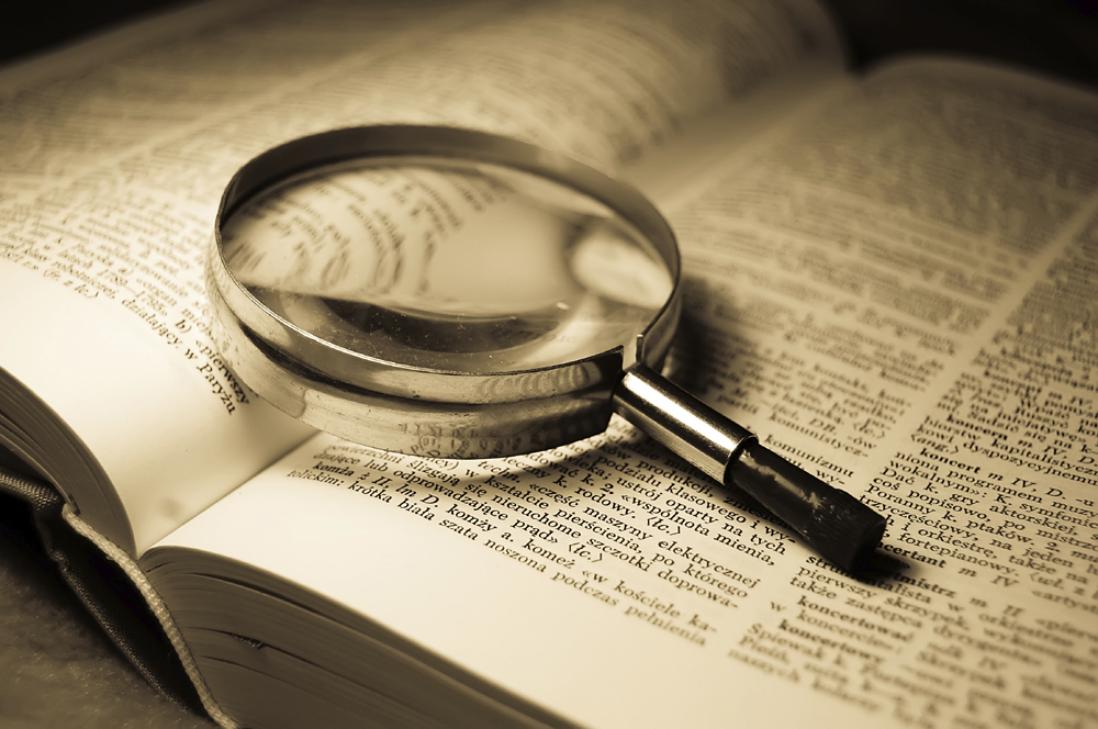 Book and glass loupe